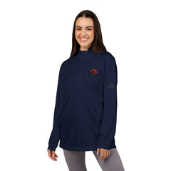 Woman wearing navy quarter-zip pullover with red rose embroidery and gray leggings