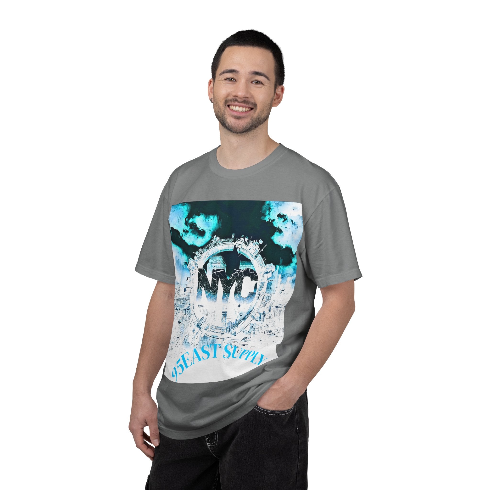 Man wearing gray NYC graphic tee with 95EAST SUPPLY text, urban skyline design, blue and white print