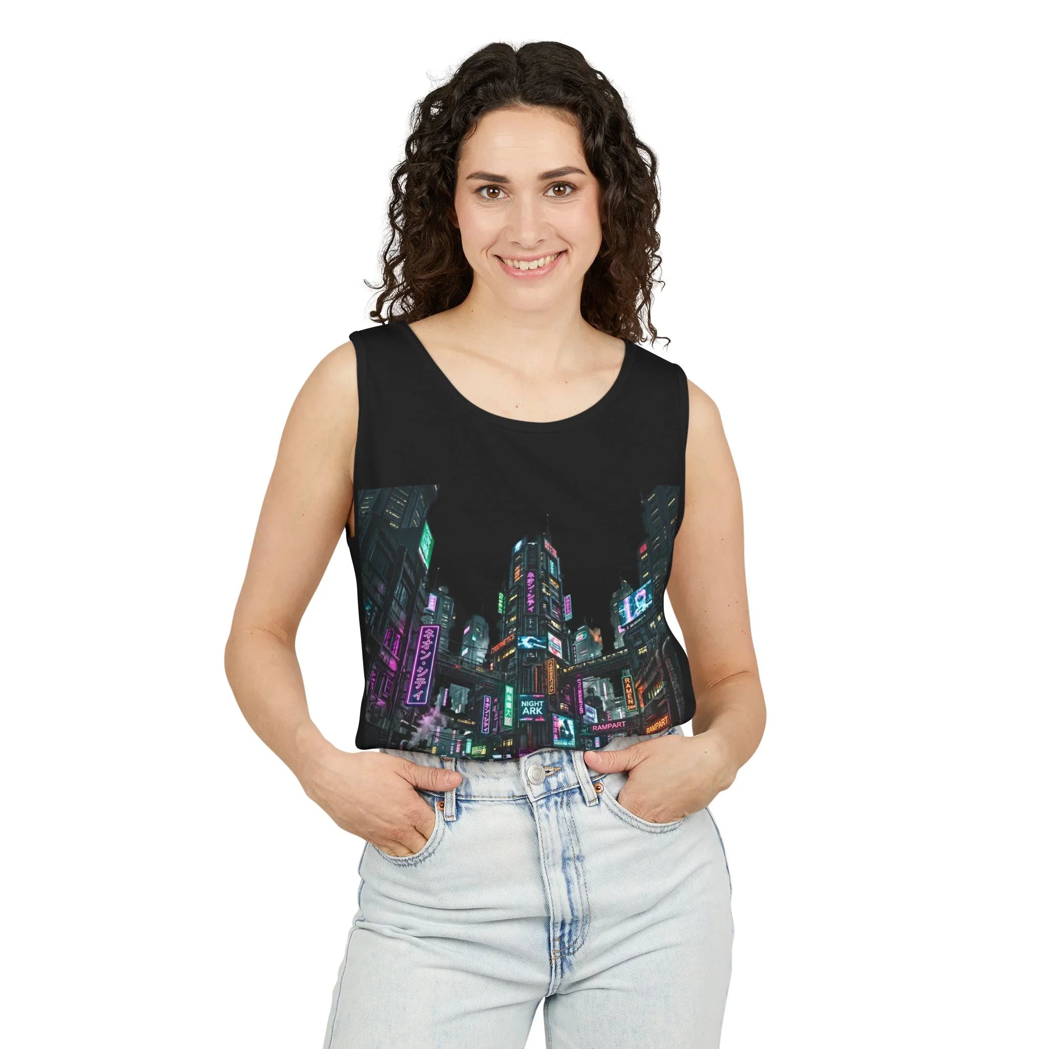 Woman wearing black crop top with neon cityscape print, light blue high-waisted jeans