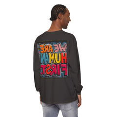 Man wearing black long sleeve shirt with colorful graffiti text design on back, casual style