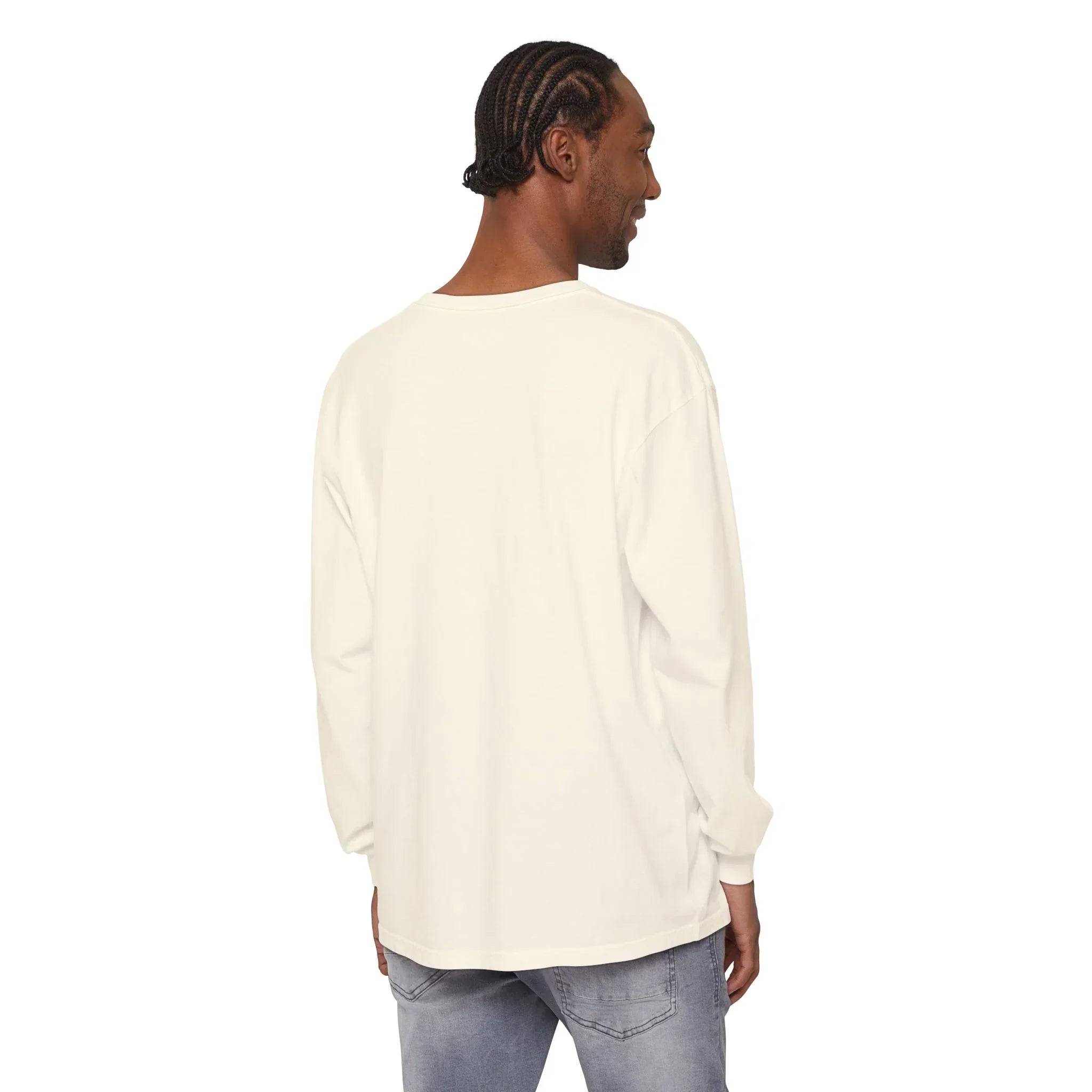 Man wearing off-white long sleeve tee with relaxed fit, paired with light wash jeans, showcasing casual streetwear style.