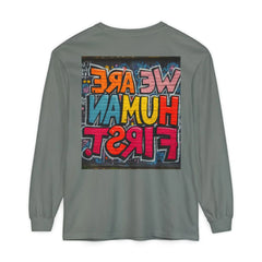 Gray long sleeve shirt with colorful graffiti text graphic reading 'WE ARE HUMAN FIRST' on back