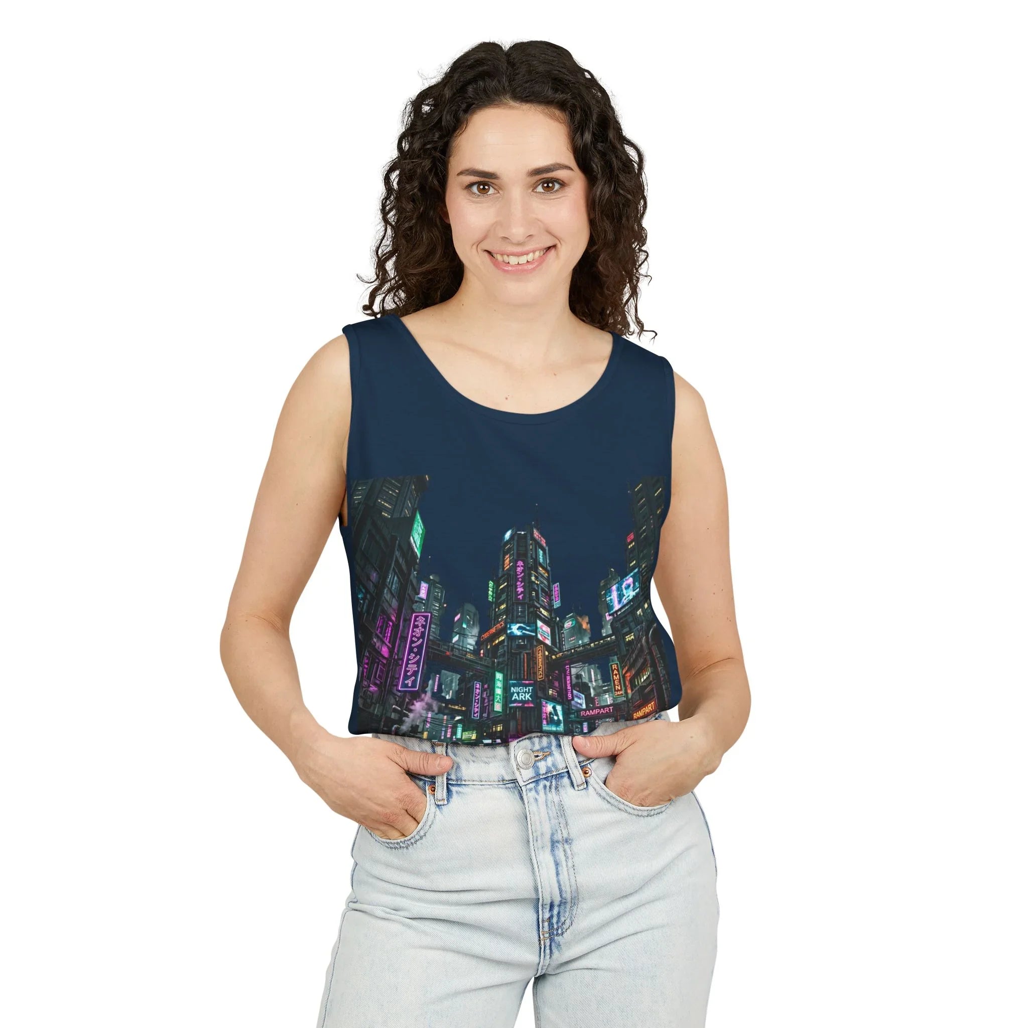 Woman wearing sleeveless top with neon cityscape print, casual light jeans, white background