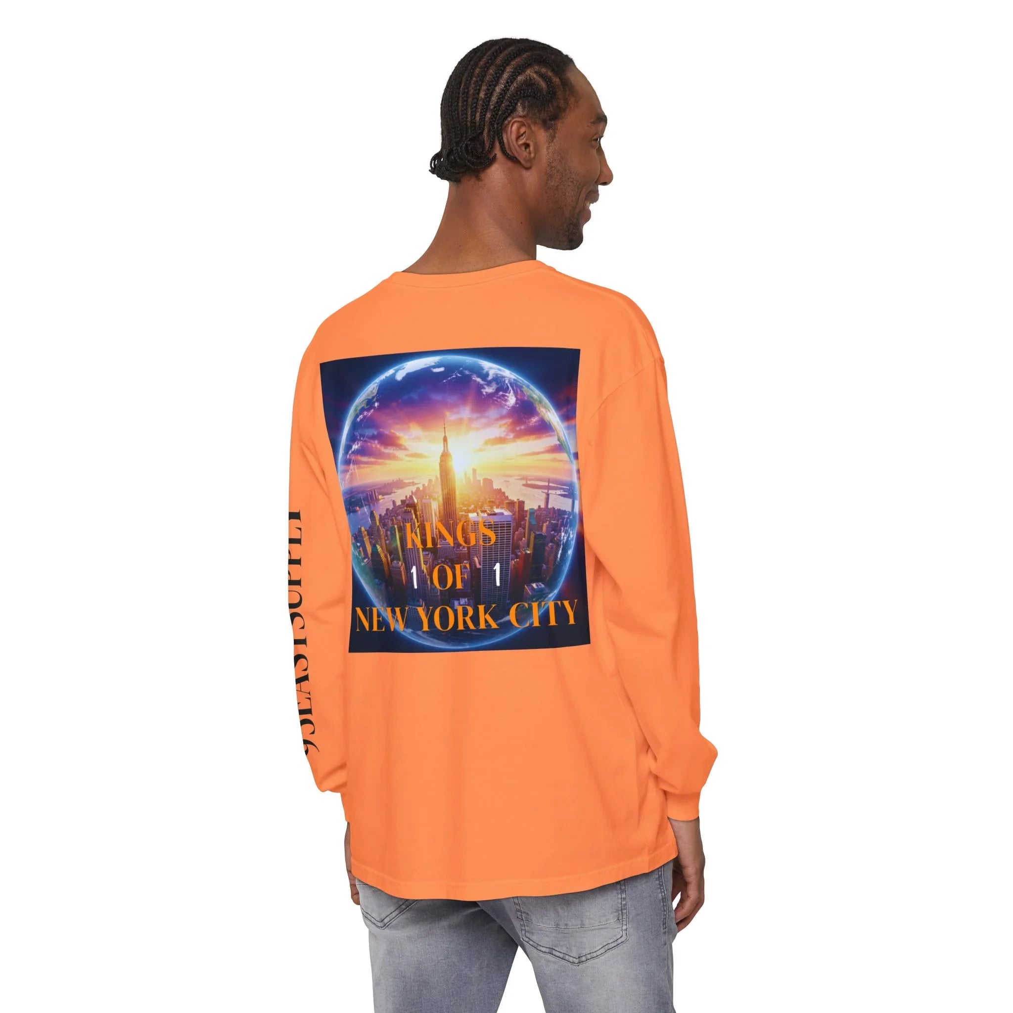 Orange long sleeve tee with 'Kings of New York City' graphic, city skyline inside globe, and side text detail.