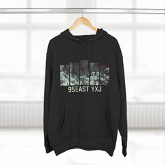 Black hoodie with graphic bars and text '95EAST YXJ' hanging on wooden hanger
