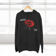 Black hoodie with red rose graphic and barcode sleeve detail, featuring 95EAST and YxJ text