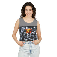 Woman wearing gray NYC 95 graphic tank top with urban street art design, paired with light denim jeans.