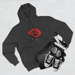 Black hoodie with red rose graphic and barcode sleeve detail, styled with jeans and sneakers