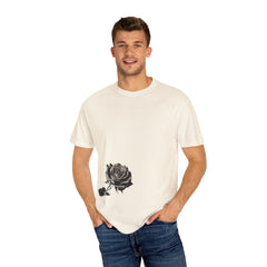 Man wearing cream t-shirt with black rose graphic, paired with blue jeans