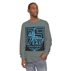 Man wearing gray long sleeve tee with bold 95 East YorkxJersey graphic, featuring city skyline design in blue and black.