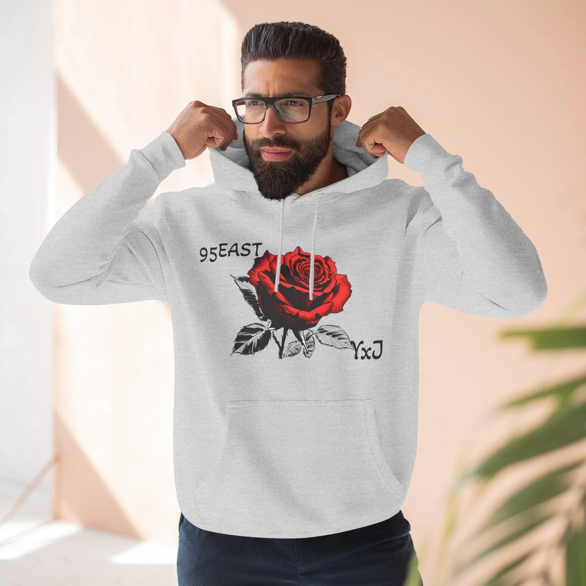 Black hoodie with rose graphic and barcode sleeve detail