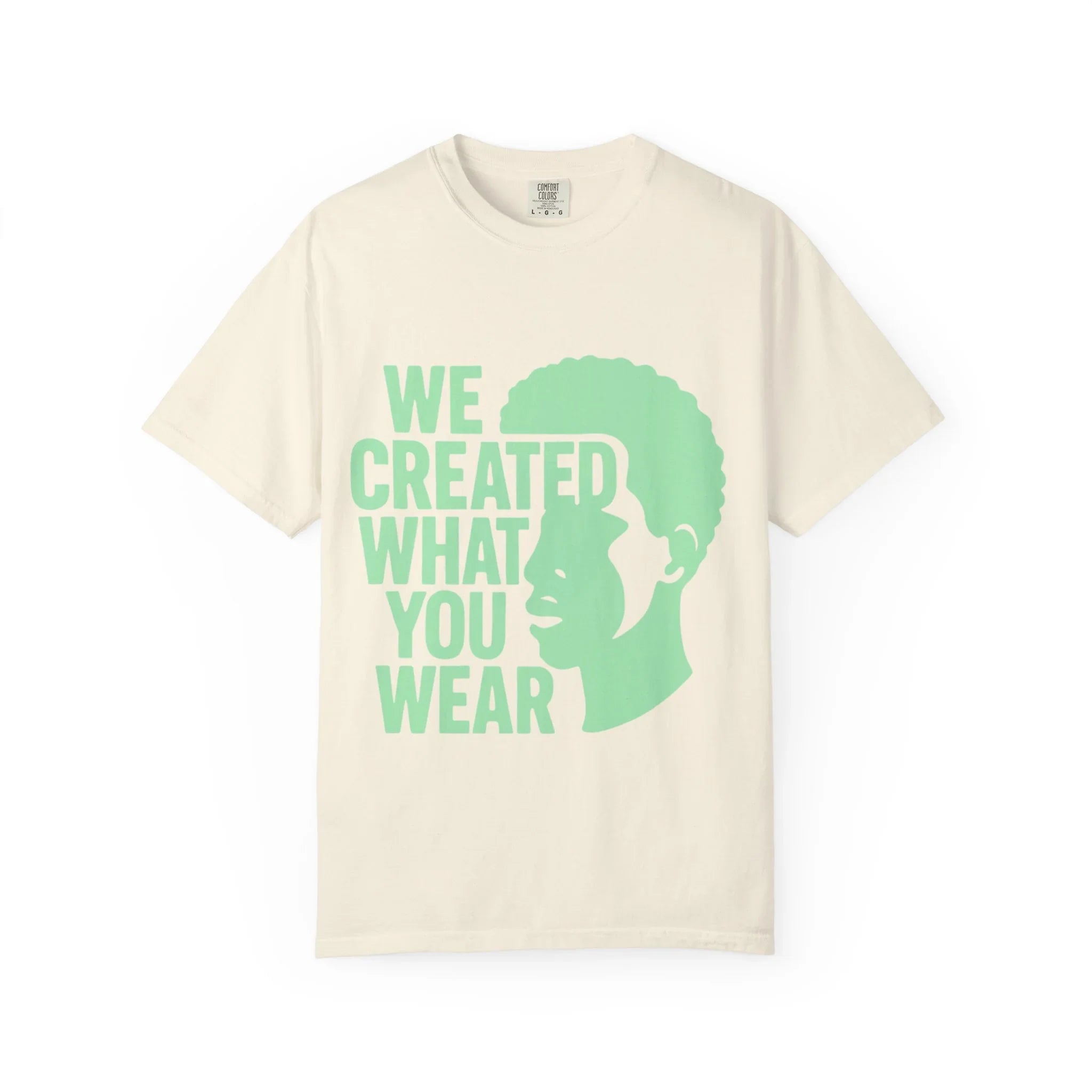 Cream t-shirt with green 'WE CREATED WHAT YOU WEAR' text and silhouette design
