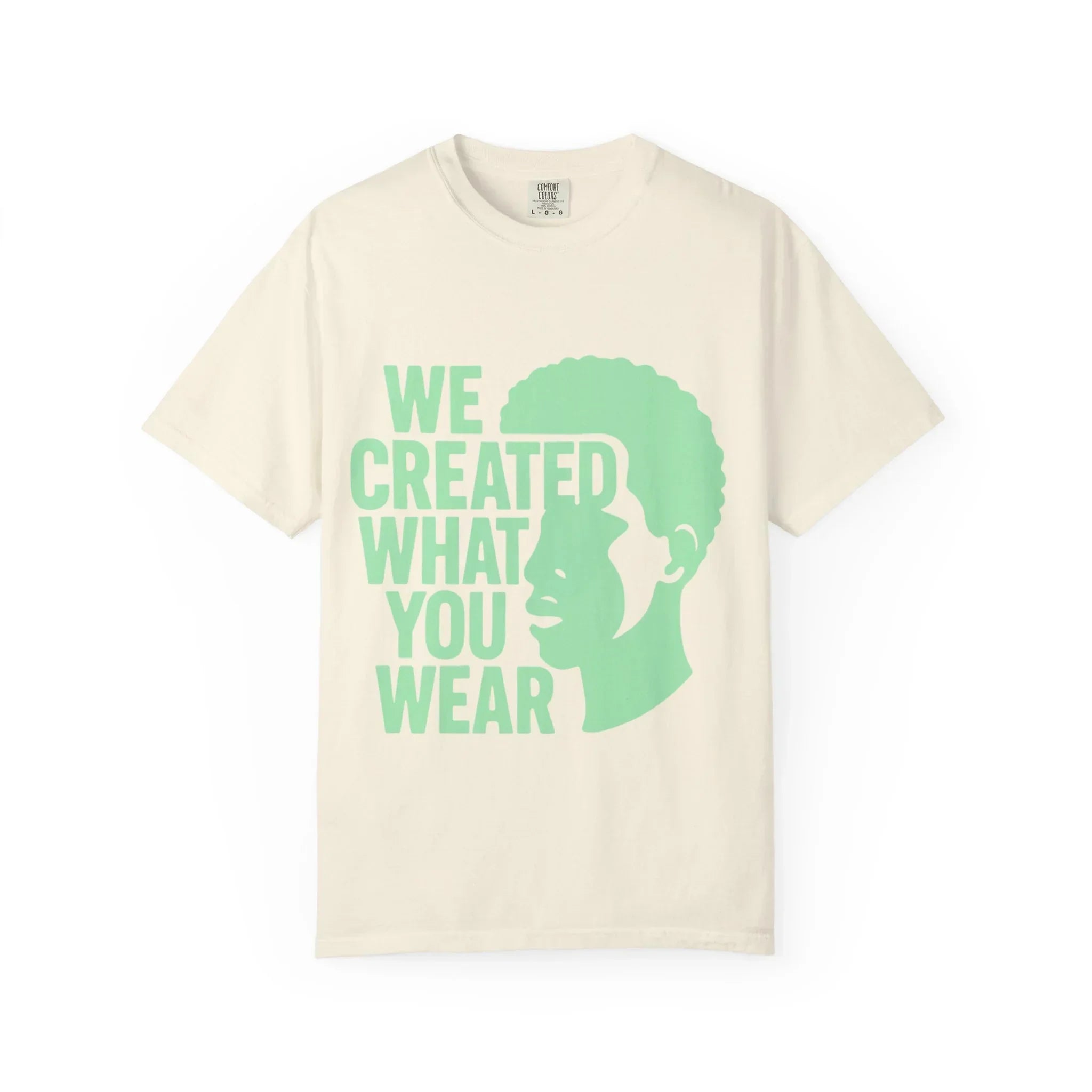 Cream t-shirt with green 'WE CREATED WHAT YOU WEAR' text and silhouette design