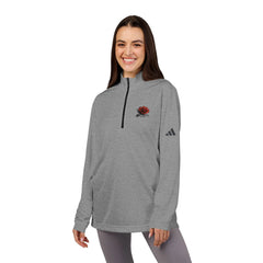Woman wearing gray quarter-zip pullover with red rose graphic and athletic logo, casual outfit