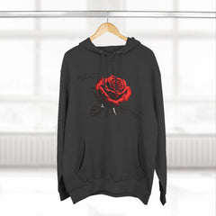 Black hoodie with red rose graphic and barcode sleeve detail, modern streetwear design