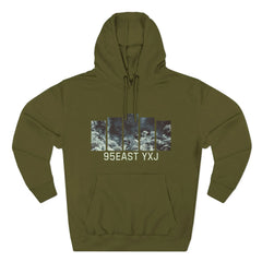 Olive green hoodie with abstract ocean graphic and text '95EAST YXJ' on front.
