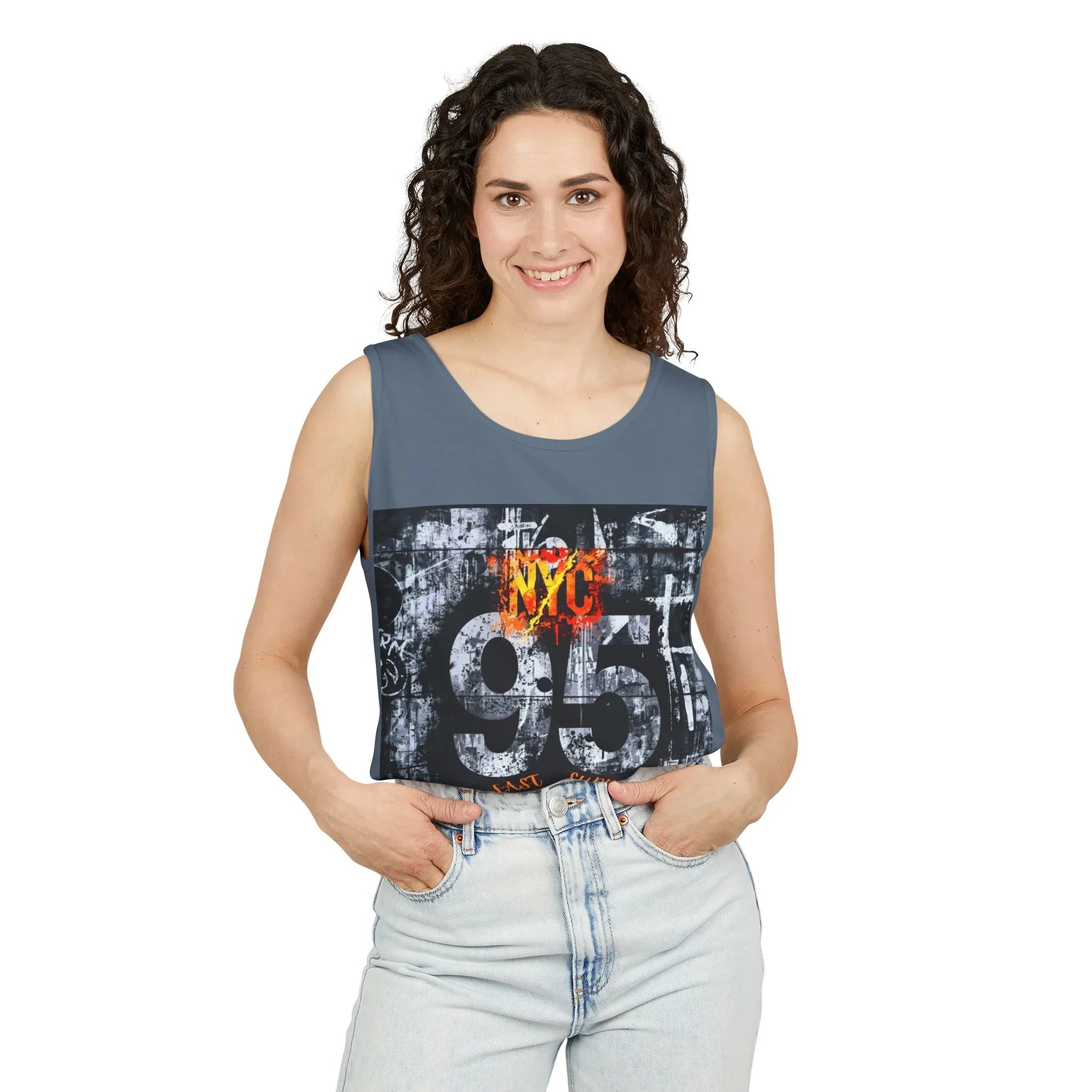 Woman wearing gray sleeveless tank top with bold NYC 95 graphic print, paired with light wash jeans.