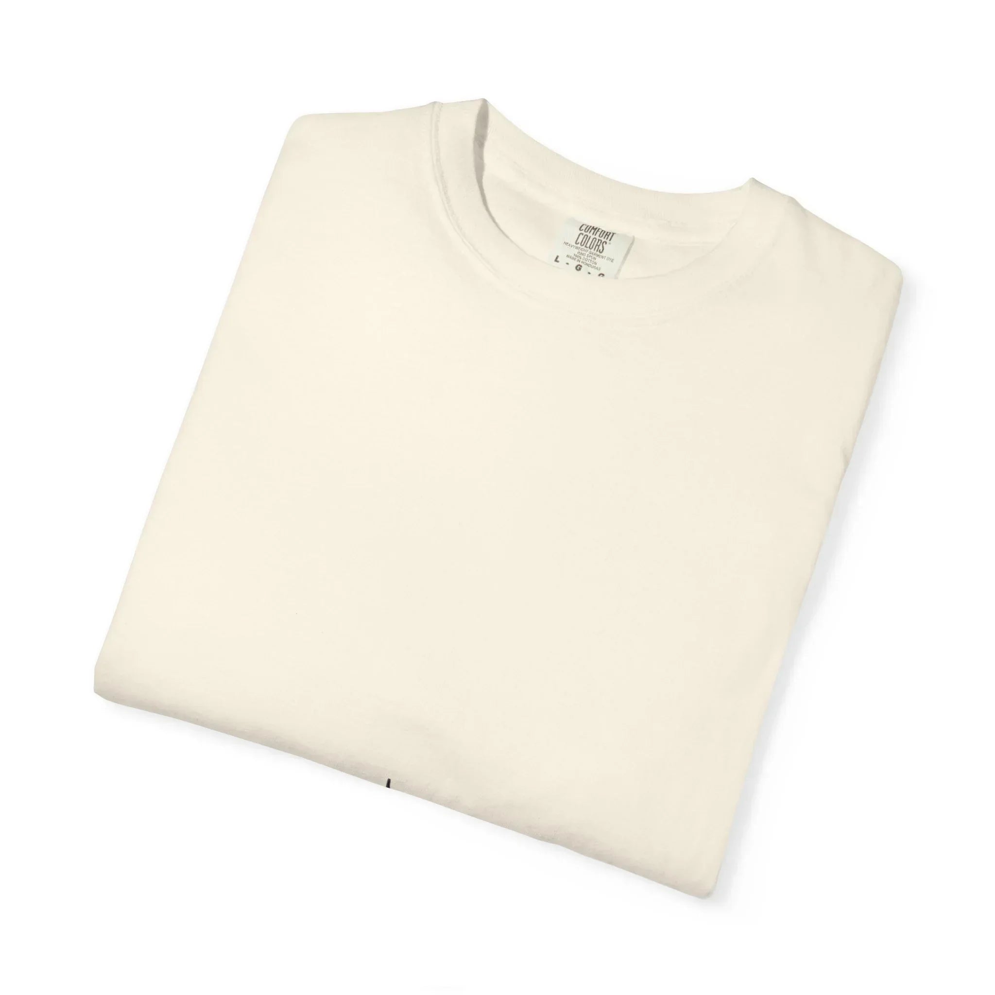 Cream-colored Comfort Colors crewneck t-shirt, neatly folded, showcasing soft cotton fabric and classic fit.