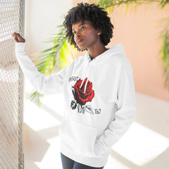 White hoodie with red rose graphic and '95EAST YxJ' text, worn by woman near mesh fence