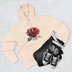 Black hoodie with red rose graphic and barcode sleeve detail, styled with jeans and sneakers