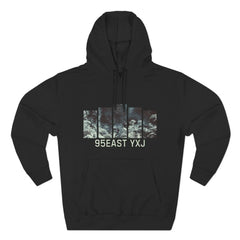 Black hoodie featuring a graphic print of ocean waves and 95EAST YXJ text on front.