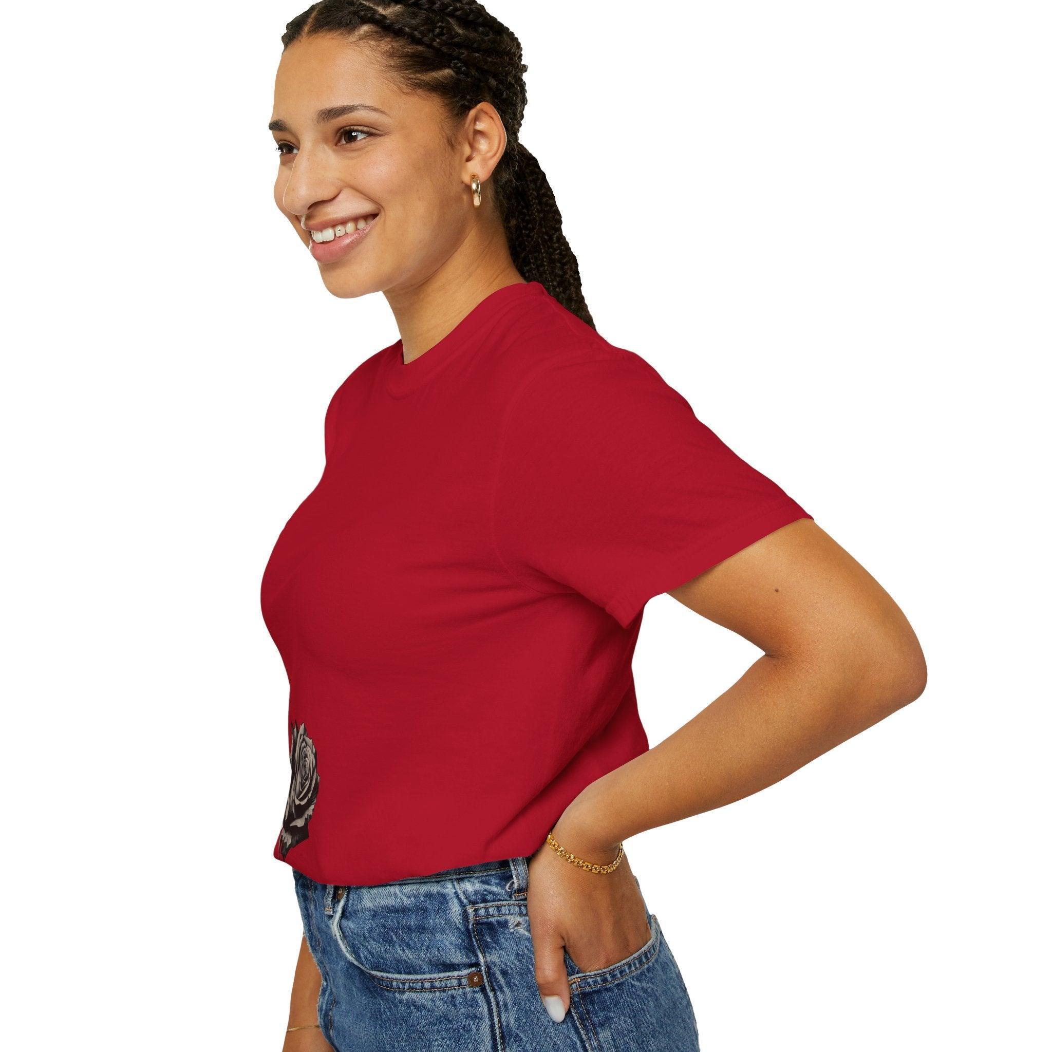 Woman in red graphic tee with rose print, styled with jeans for casual everyday wear