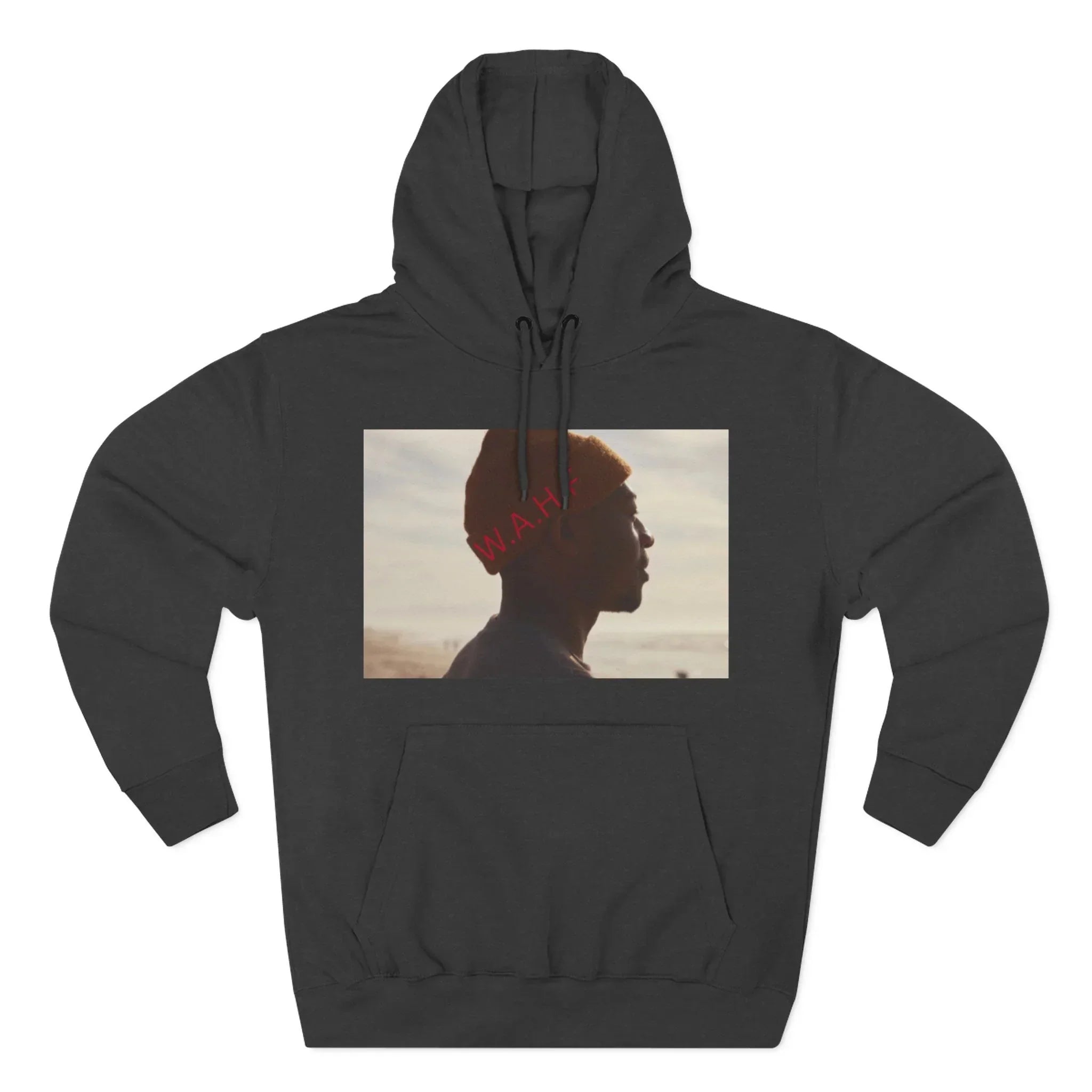 Black hoodie featuring a photo of a man in profile wearing a beanie on a beach at sunset