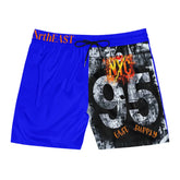 Blue board shorts with NYC 95 graphic, black drawstring, and East Supply print