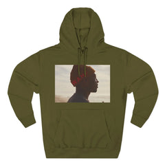 Olive green hoodie featuring profile photo of man in orange hat, casual streetwear style
