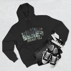 Flat lay of black graphic hoodie with 95EAST YXJ print, black jeans, belt, and sneakers
