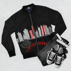 Black bomber jacket with cityscape print, rose, and '95EAST SUPP' text, paired with jeans and sneakers