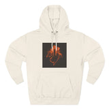 Beige hoodie with orange city skyline and hand graphic on front