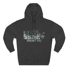 Black hoodie with abstract forest panel graphic and 95EAST YXJ text on front