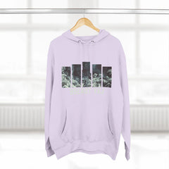 Light purple hoodie with abstract nature graphic bars and front pocket, displayed on hanger