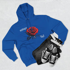 Blue hoodie with red rose graphic and '95EAST YxJ' text, styled with jeans and sneakers