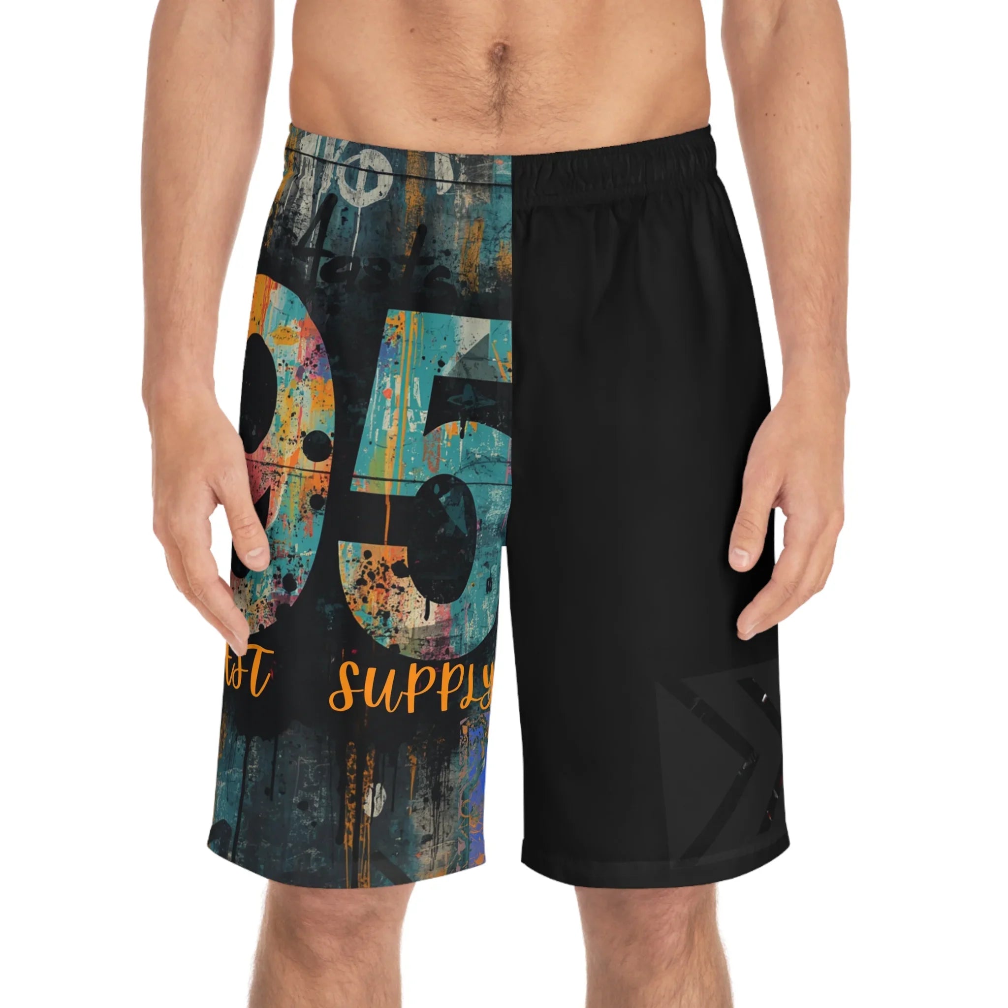 Men's graphic shorts with bold 95 print, graffiti-style art, and 'East Supply' text on one leg, solid black on other.