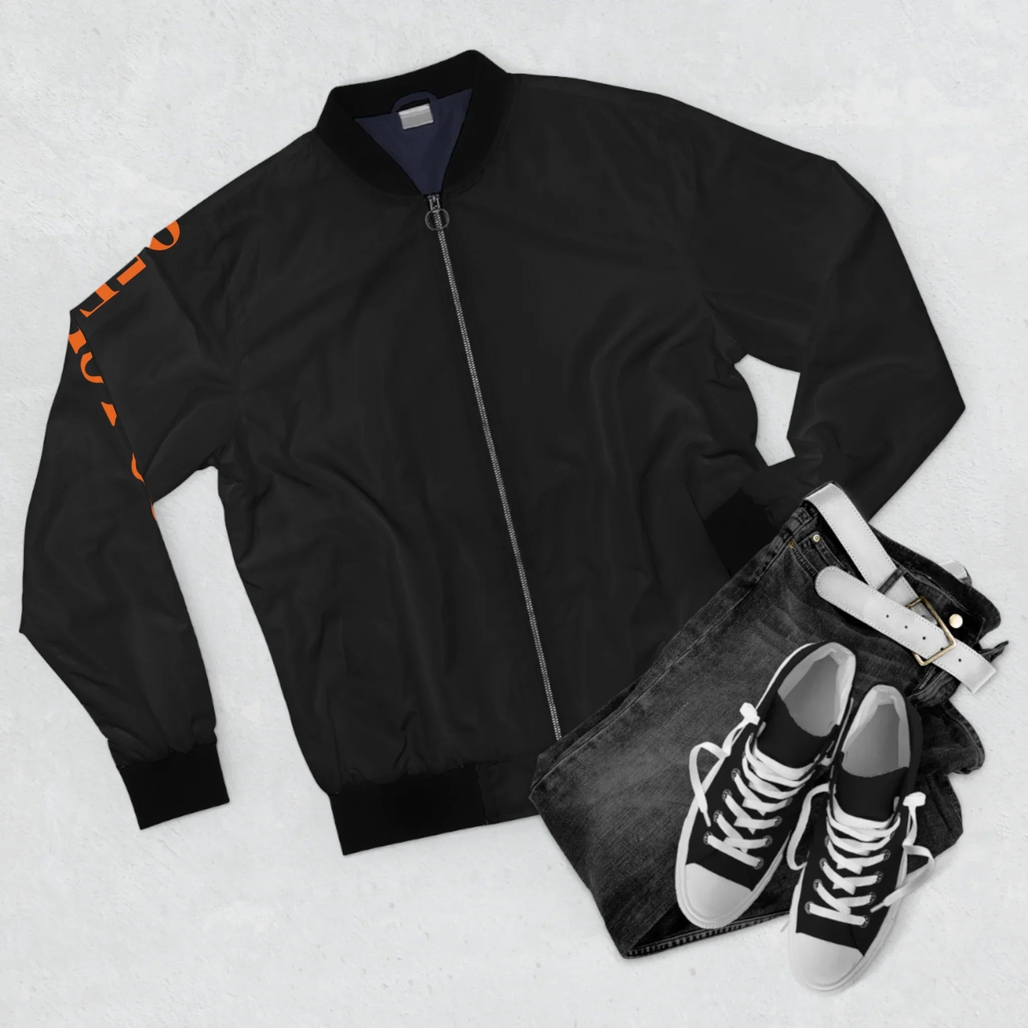 Black bomber jacket with orange sleeve print, paired with dark jeans and classic high-top sneakers for urban streetwear style