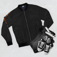 Black bomber jacket with orange sleeve print, paired with dark jeans and classic high-top sneakers for urban streetwear style