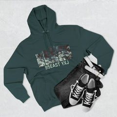 Dark green hoodie with 95EAST YXJ graphic, black jeans, white belt, and black sneakers laid out on light background.