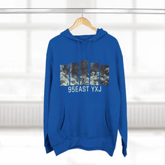 Blue hoodie with abstract vertical graphic and 95EAST YXJ text, hanging indoors