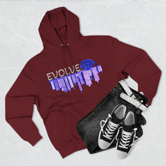 Maroon hoodie with blue rose and city skyline graphic, paired with jeans and sneakers
