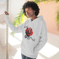 Gray hoodie with red rose graphic and YxJ text, worn by woman near mesh fence and palm leaves
