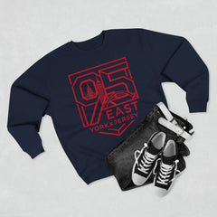 Navy hoodie with bold red 95 East YorkxJersey graphic, paired with jeans and sneakers for urban streetwear style.