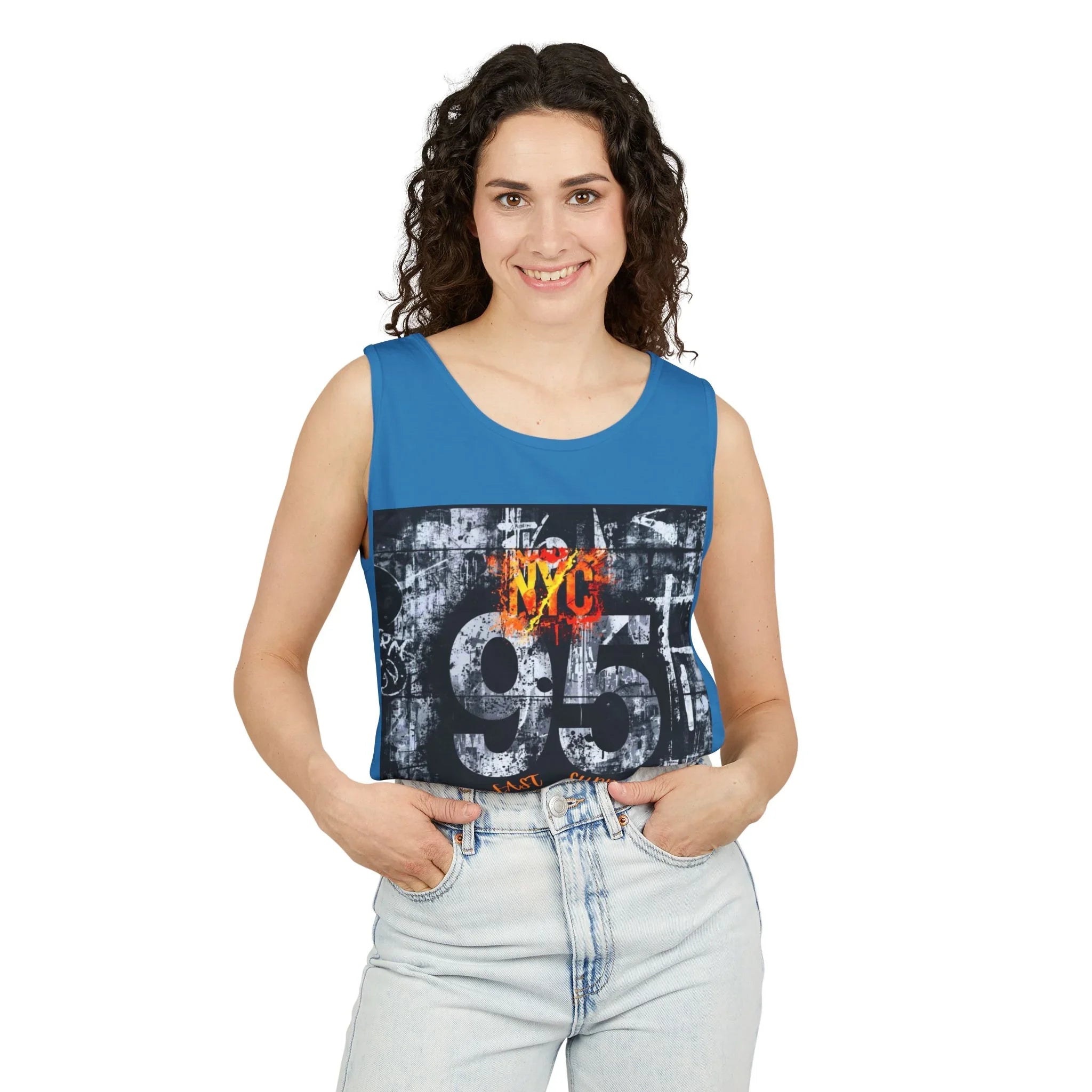 Blue sleeveless top with NYC 95 graphic, paired with light denim jeans for urban style.