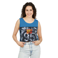 Blue sleeveless top with NYC 95 graphic, paired with light denim jeans for urban style.