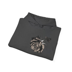 Folded black hoodie with a monochrome rose graphic on the front
