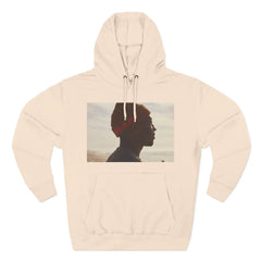 Beige hoodie with artistic beachside silhouette photo and red W.A.H. text on chest