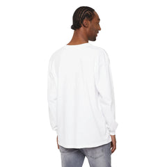 Man wearing white long-sleeve shirt and gray jeans, showcasing casual East Coast style