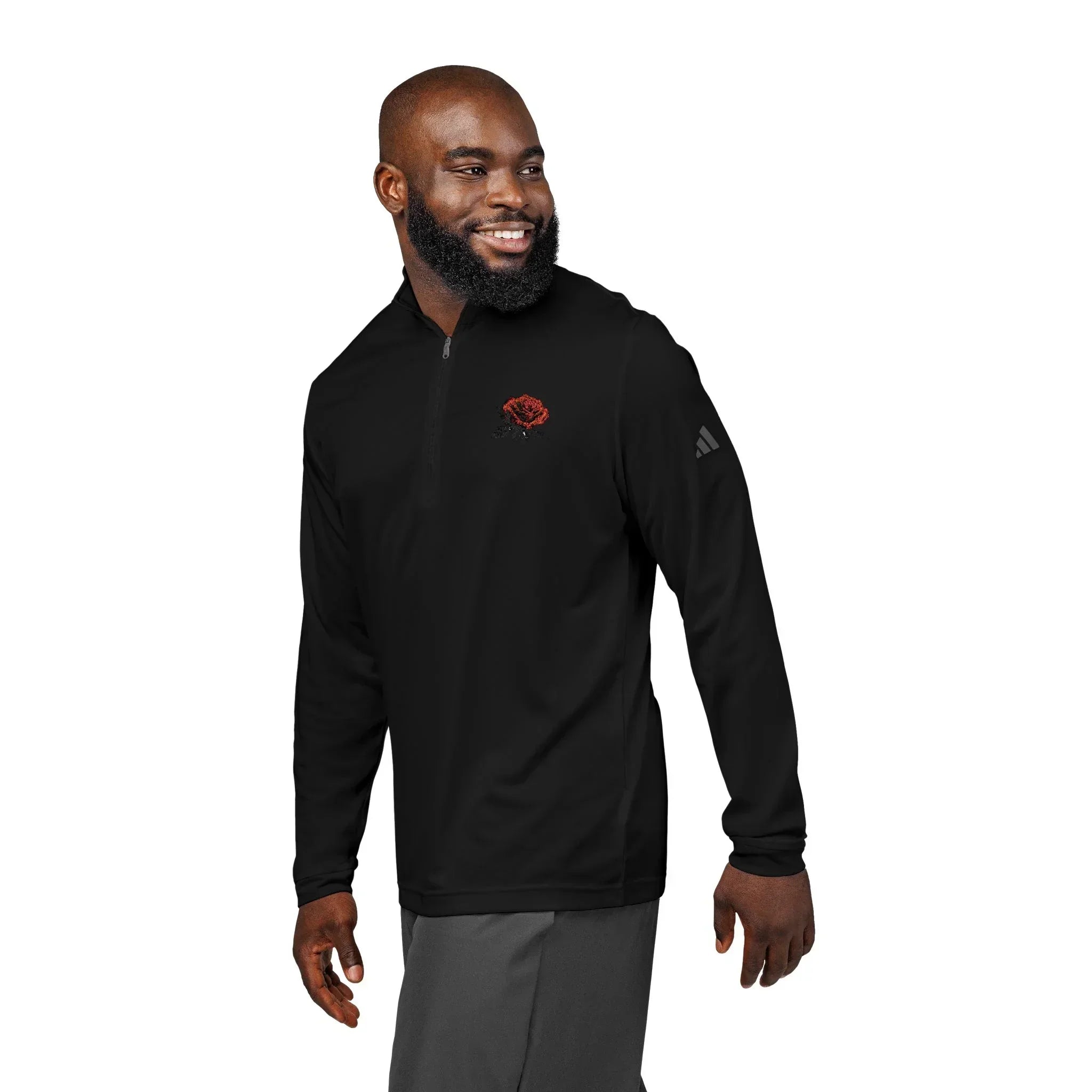 Man wearing black quarter-zip pullover with red rose embroidered on chest, casual style