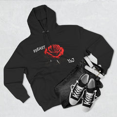 Black hoodie with red rose graphic and barcode sleeve detail, styled with jeans and sneakers